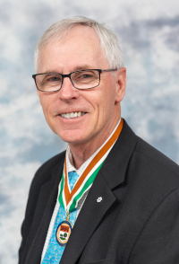 A photo of Dr. Ed MacDonald, 2024 Order of PEI recipient, wearing the Medal of Merit.